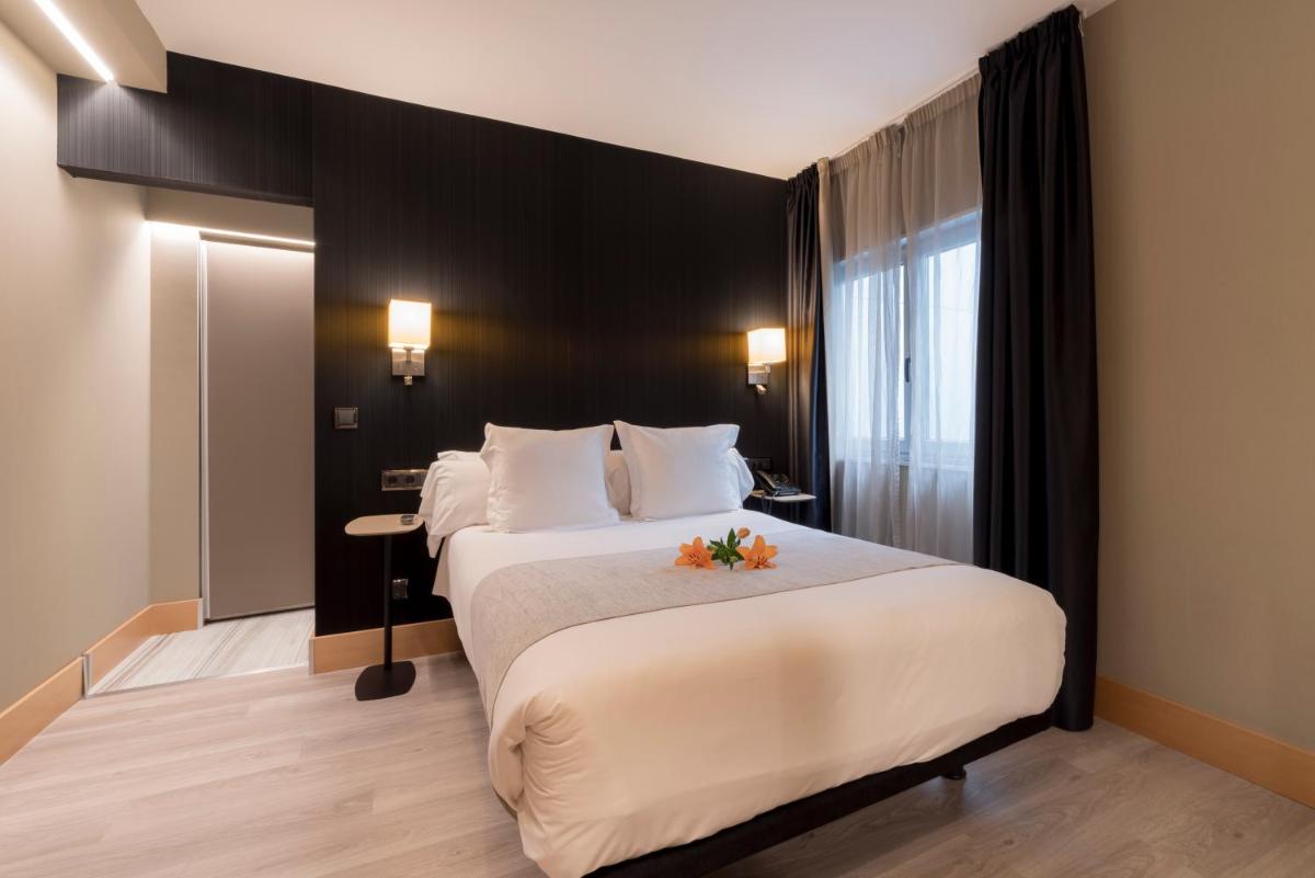 Cama o camas de una habitación en Hotel Plaza