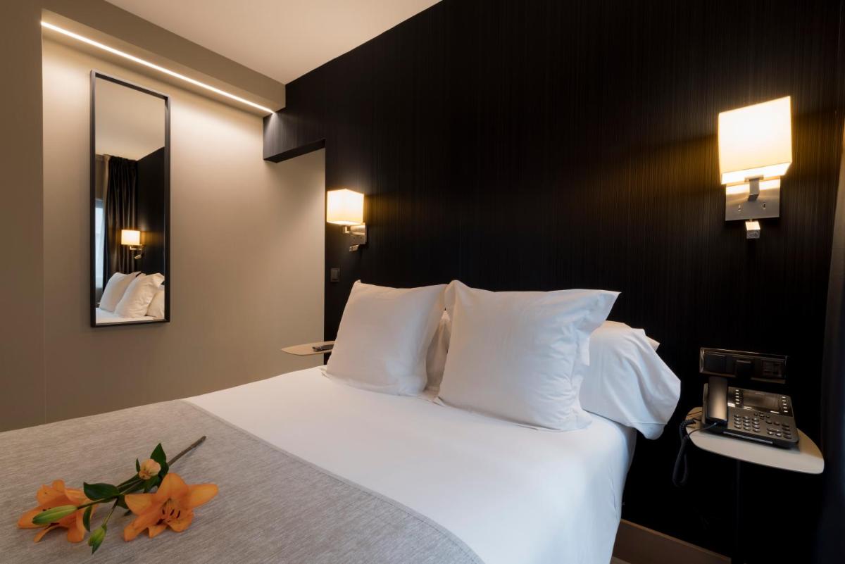 Cama o camas de una habitación en Hotel Plaza