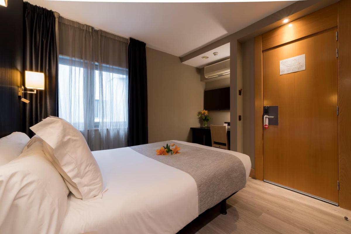 Cama o camas de una habitación en Hotel Plaza