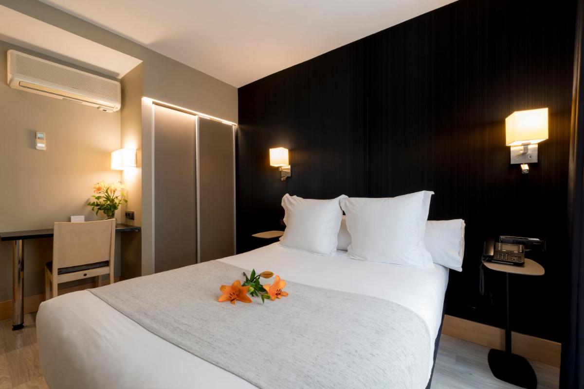 Cama o camas de una habitación en Hotel Plaza