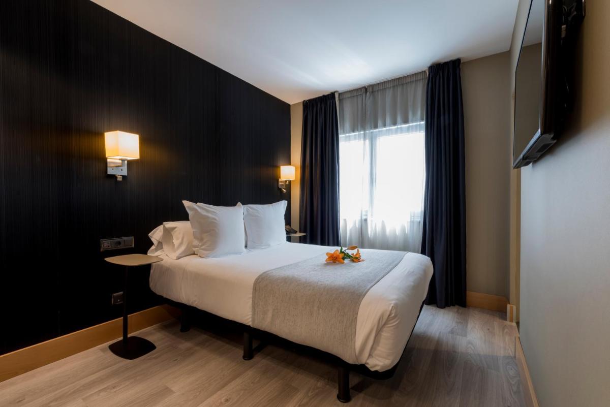 Cama o camas de una habitación en Hotel Plaza