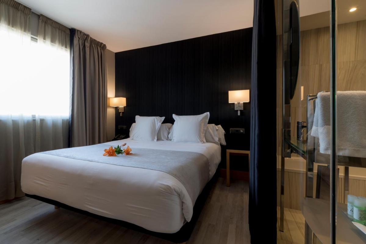 Cama o camas de una habitación en Hotel Plaza