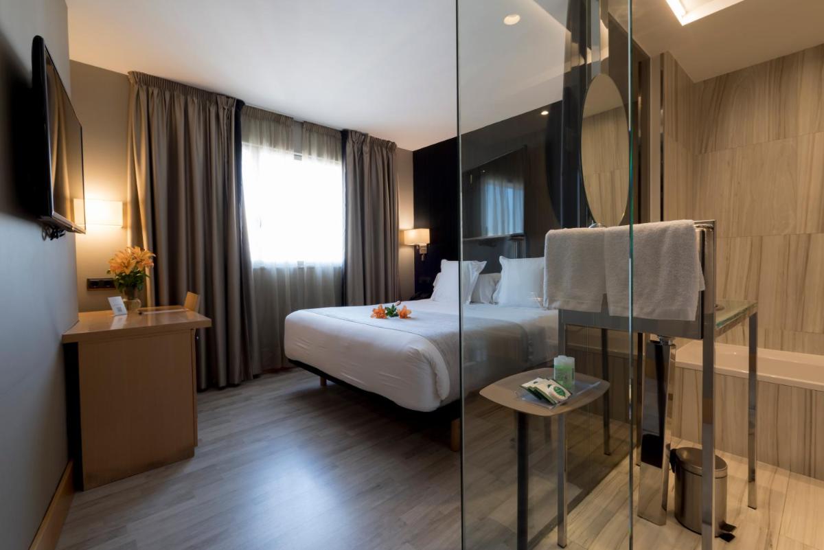 Cama o camas de una habitación en Hotel Plaza