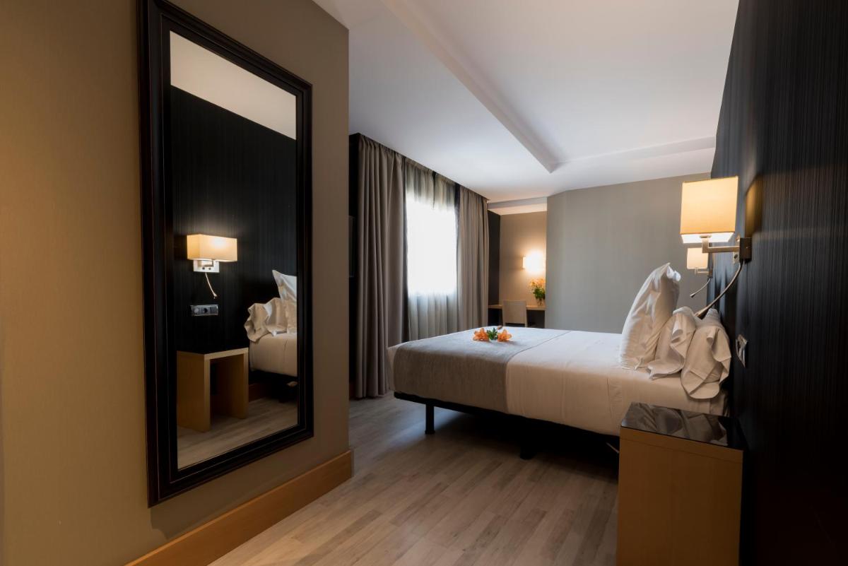 Cama o camas de una habitación en Hotel Plaza