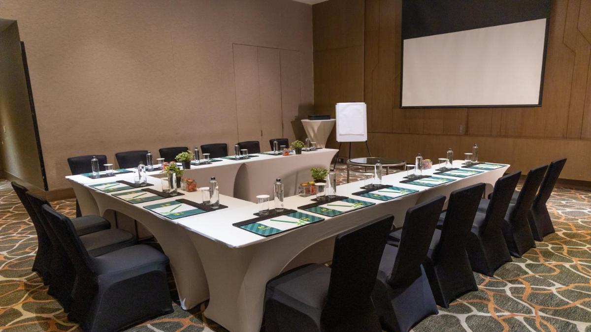a conference room with a long table and chairs at Holiday Inn New Delhi Aerocity by IHG in New Delhi
