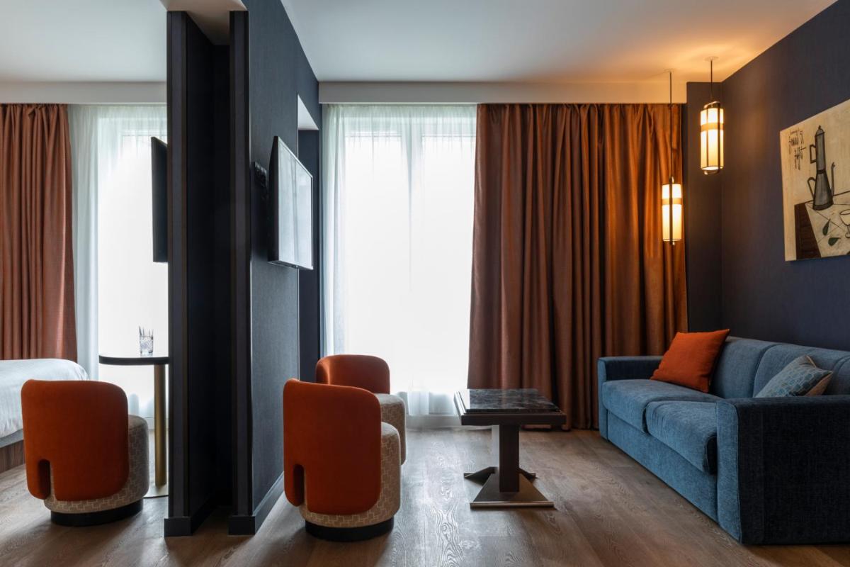 Coin salon dans l'établissement Hôtel & Spa Oceania Le Conti