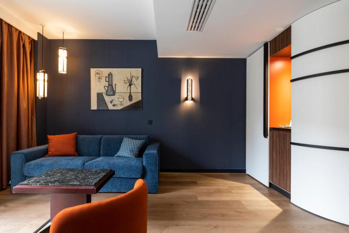 Coin salon dans l'établissement Hôtel & Spa Oceania Le Conti
