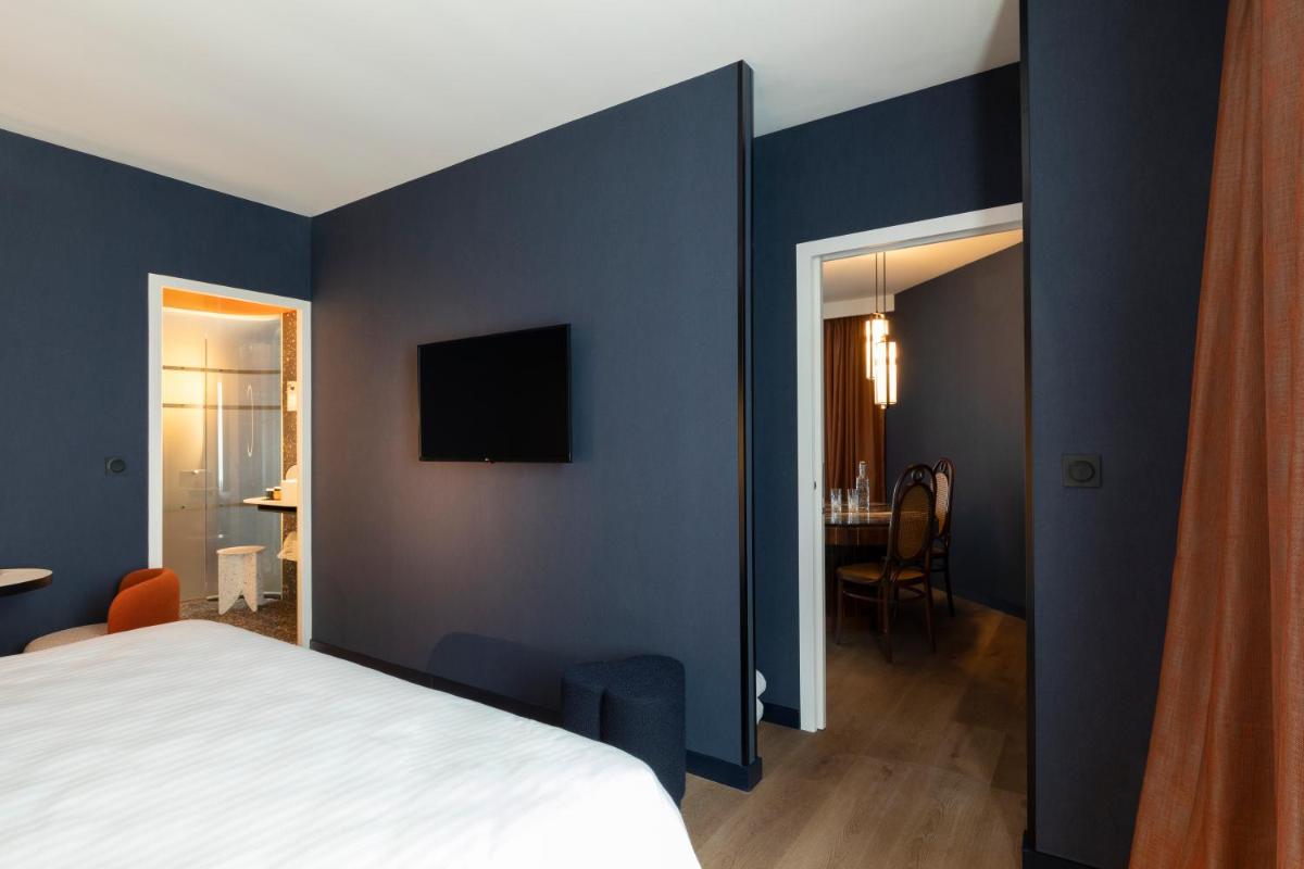Un ou plusieurs lits dans un hébergement de l'établissement Hôtel & Spa Oceania Le Conti