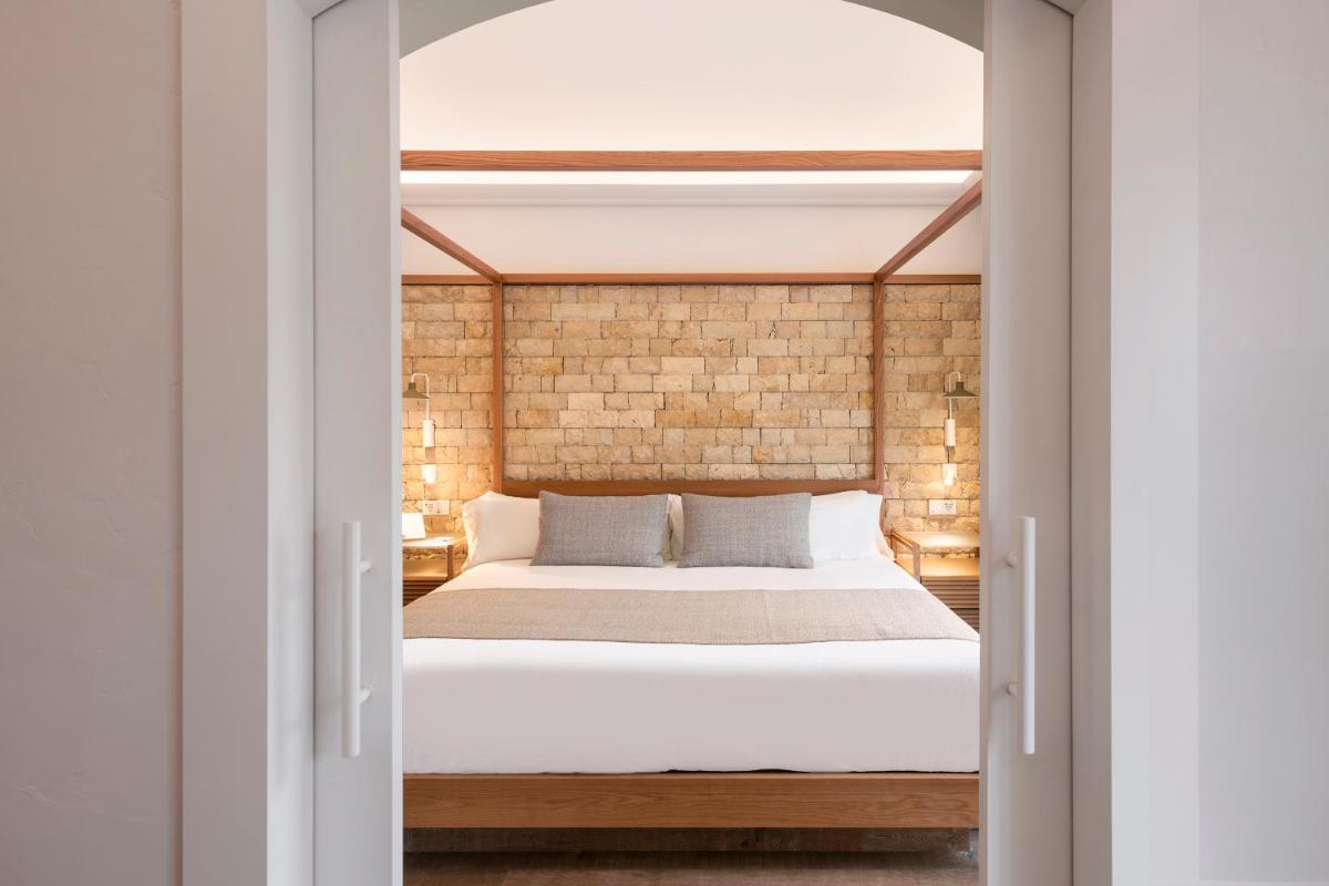 Cama o camas de una habitación en Hotel Cala del Pi - Adults Only