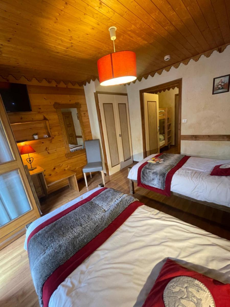 Un ou plusieurs lits dans un hébergement de l'établissement Hotel Le Ferraillon