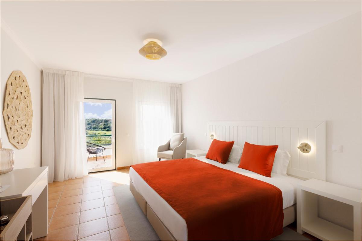 Uma cama ou camas num quarto em Hotel Rural Quinta do Marco - Nature & Dining