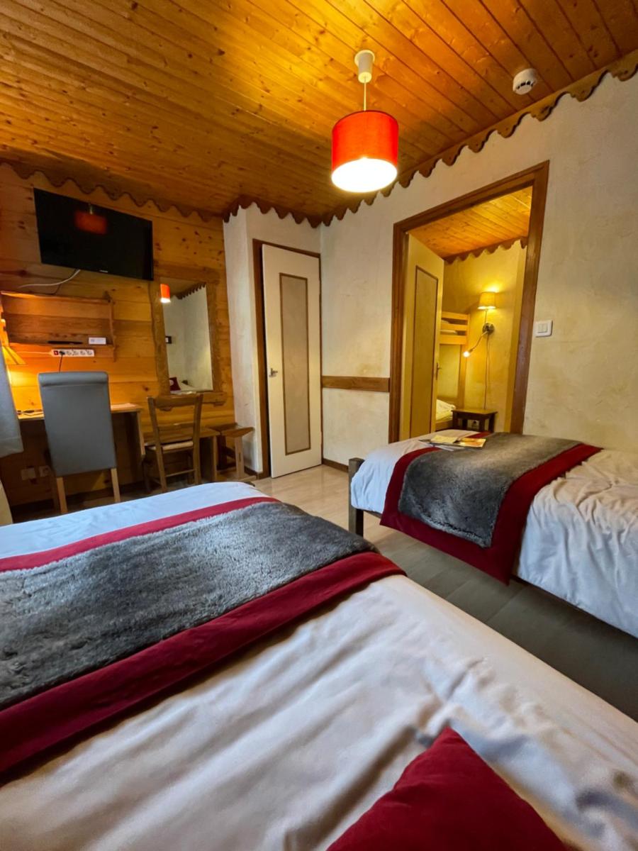 Un ou plusieurs lits dans un hébergement de l'établissement Hotel Le Ferraillon