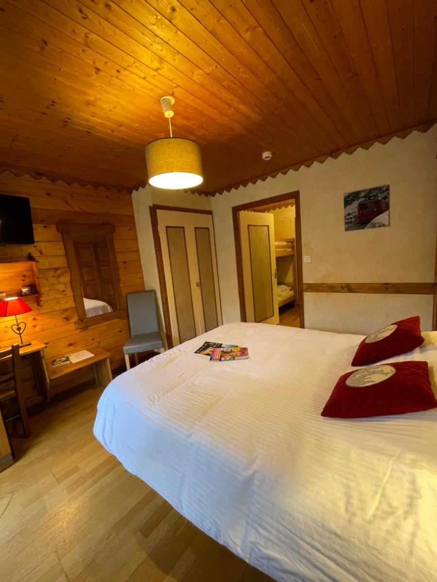 Un ou plusieurs lits dans un hébergement de l'établissement Hotel Le Ferraillon