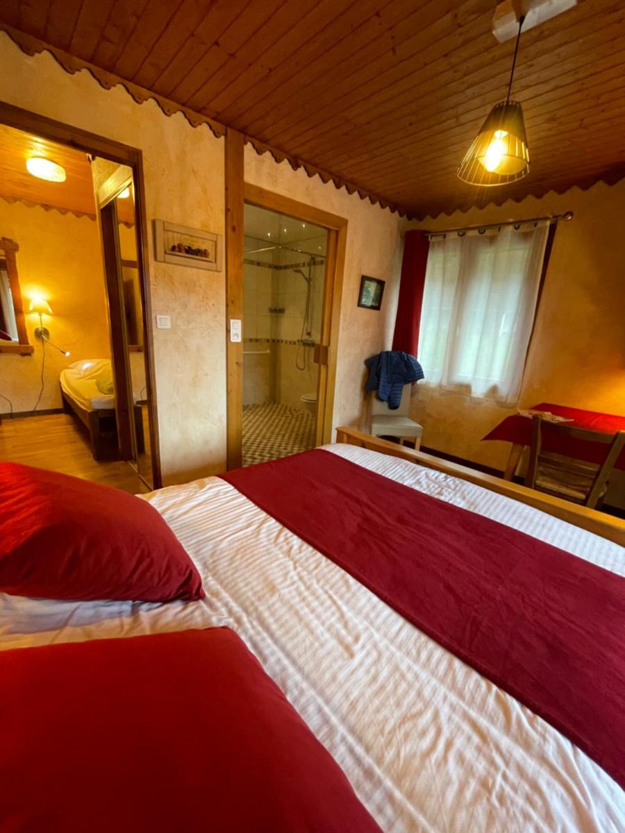 Un ou plusieurs lits dans un hébergement de l'établissement Hotel Le Ferraillon