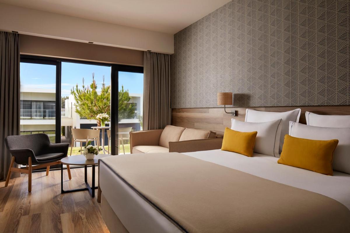 Uma cama ou camas num quarto em Tivoli Alvor Algarve - All Inclusive Resort