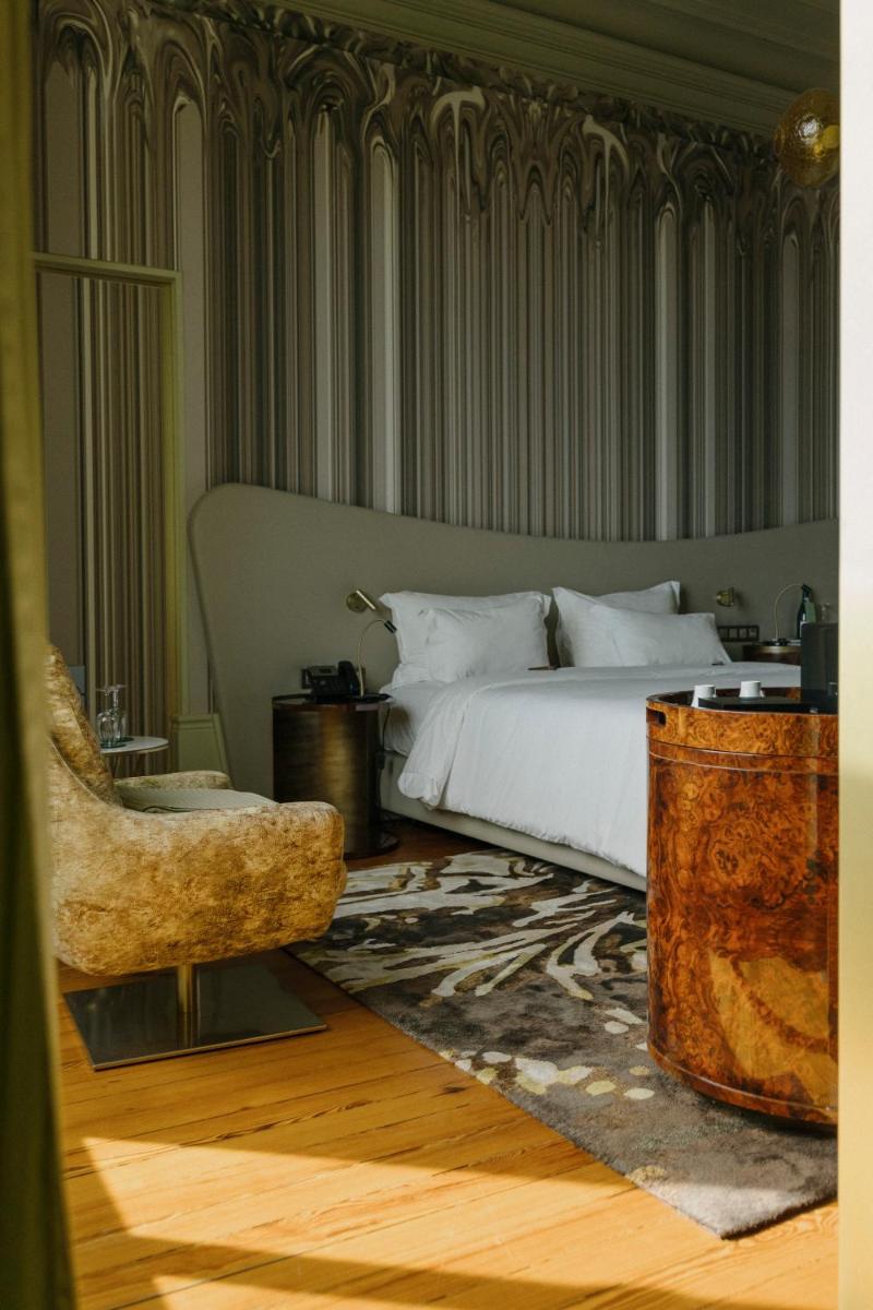 Uma cama ou camas num quarto em Vila Foz Hotel & SPA - member of Design Hotels