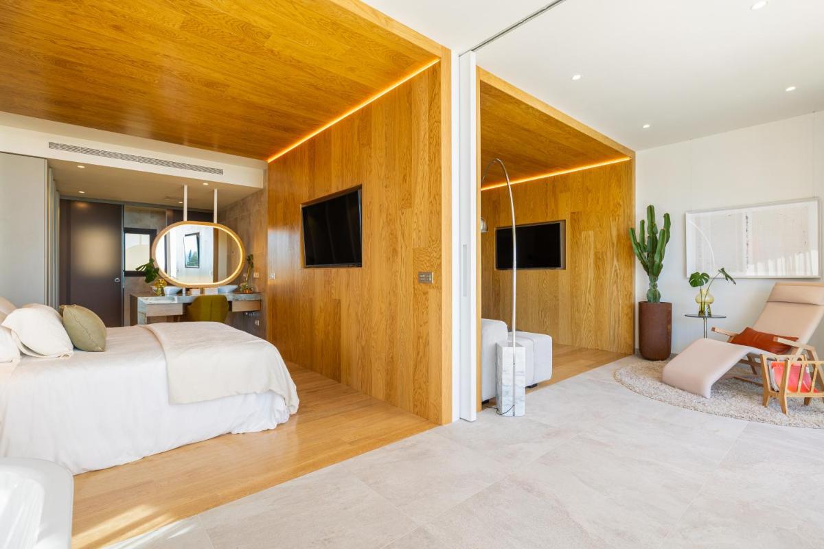 Cama o camas de una habitación en Leiro Residences - Preferred Hotels & Resorts