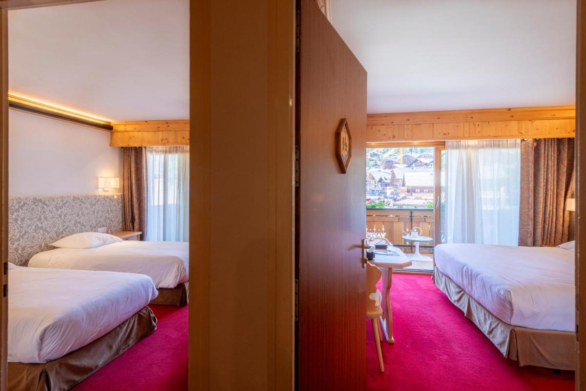 Un ou plusieurs lits dans un hébergement de l'établissement Hôtel Macchi Restaurant & Spa