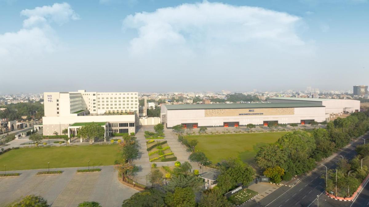 an aerial view of a building with a park at Novotel Jaipur Convention Centre in Jaipur