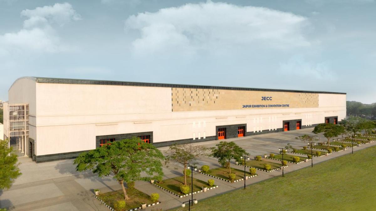 an overhead view of a building with trees in front at Novotel Jaipur Convention Centre in Jaipur