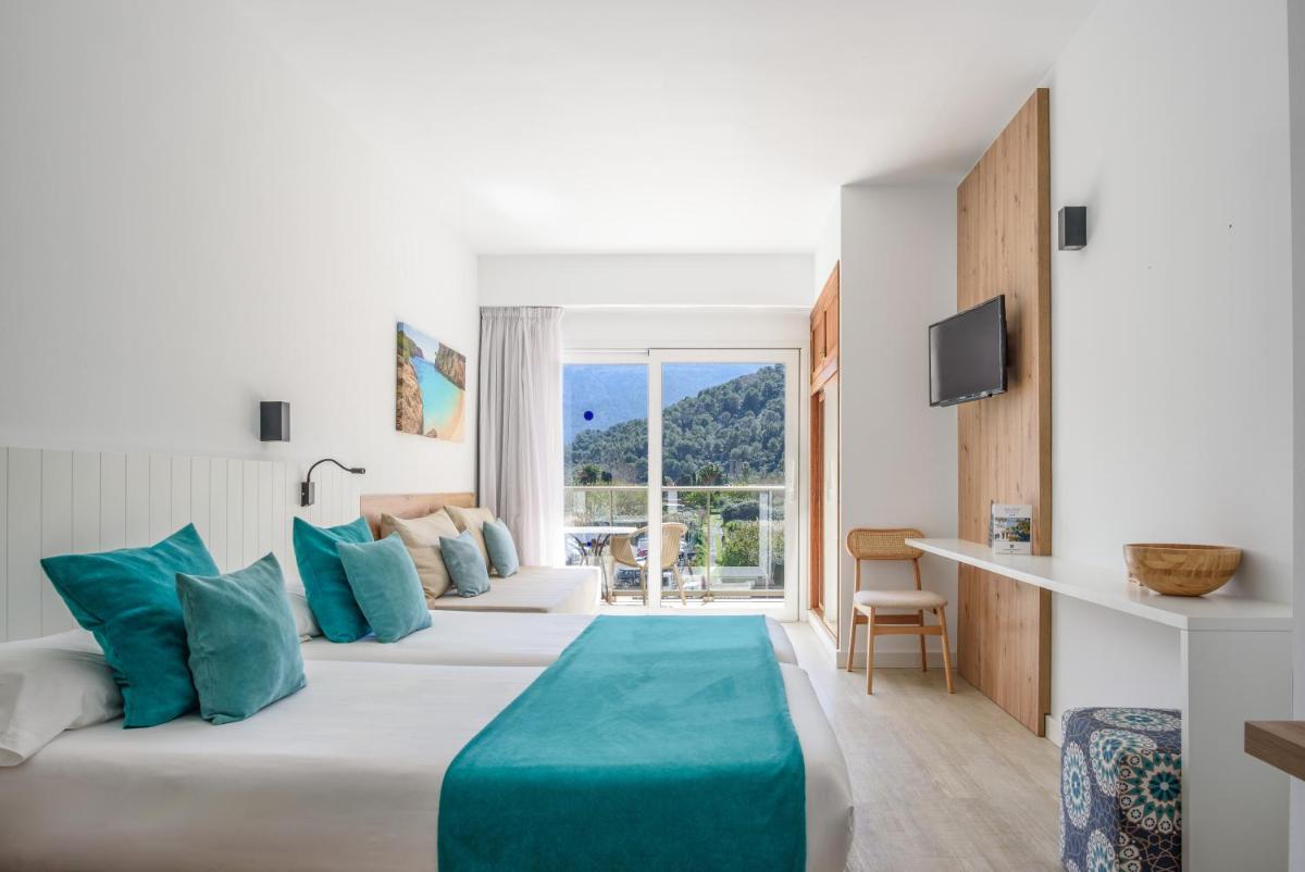 Cama o camas de una habitación en Hotel Marina