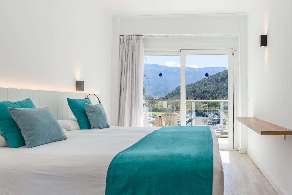 Cama o camas de una habitación en Hotel Marina
