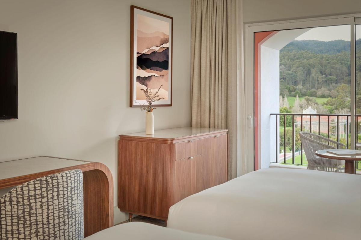 Uma cama ou camas num quarto em Penha Longa Resort