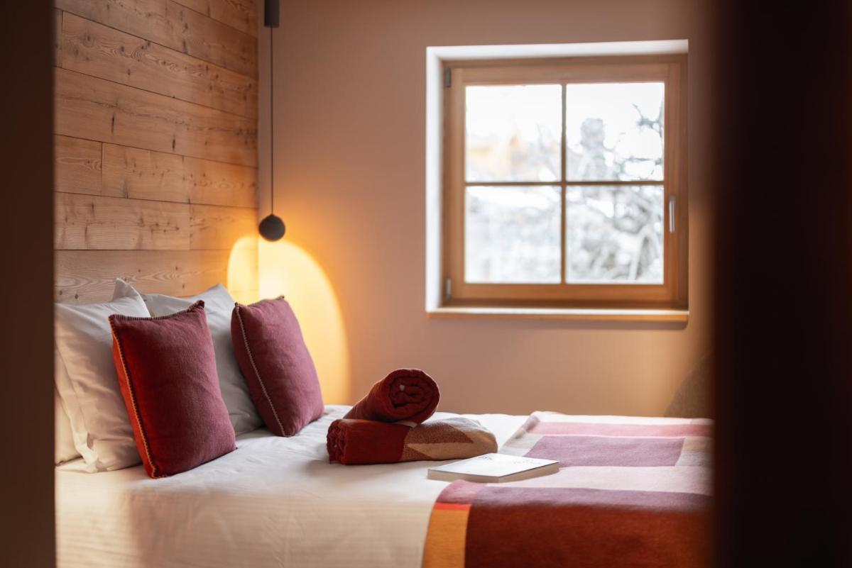 Un ou plusieurs lits dans un hébergement de l'établissement Alliey & Spa Piscine Appart-hôtel Serre chevalier