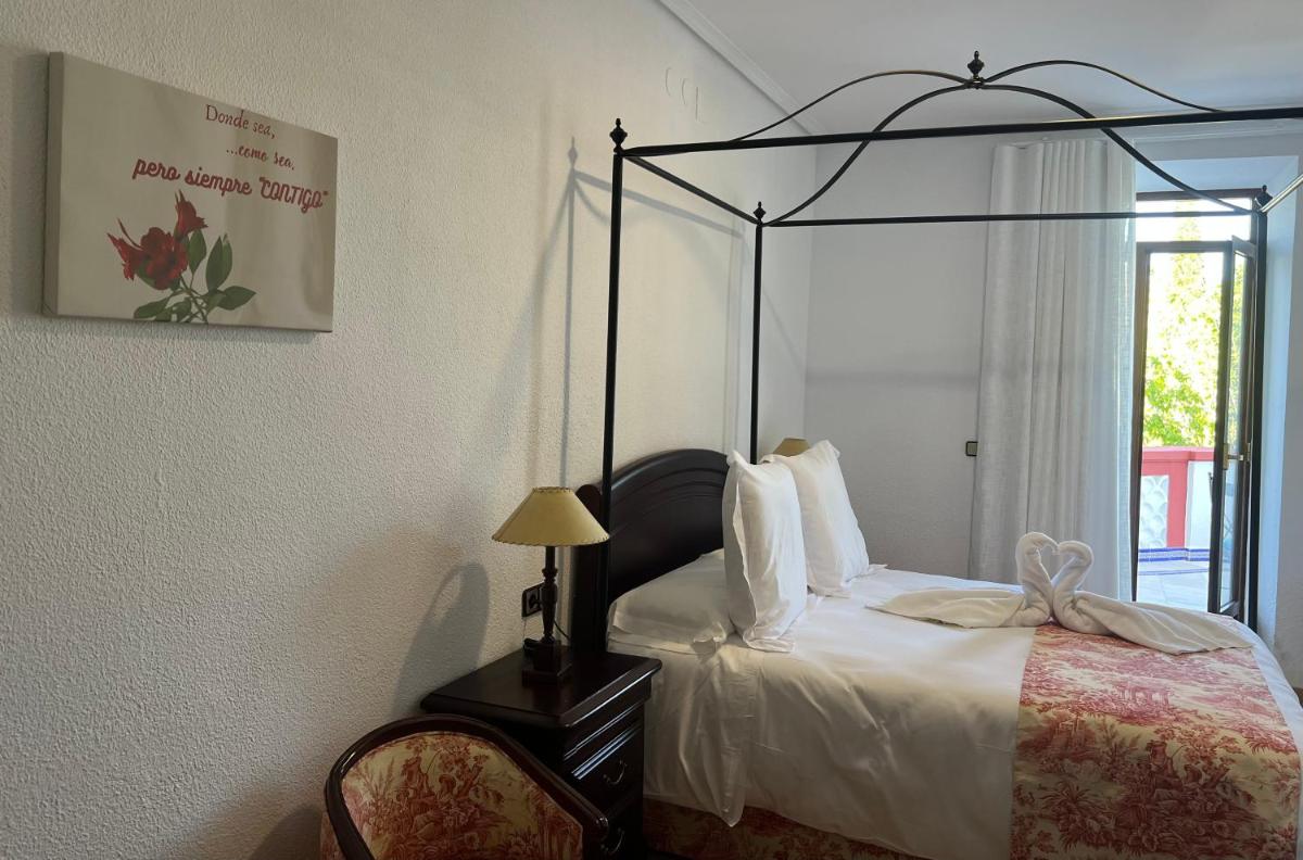 Cama o camas de una habitación en Hotel Balneario de Marmolejo