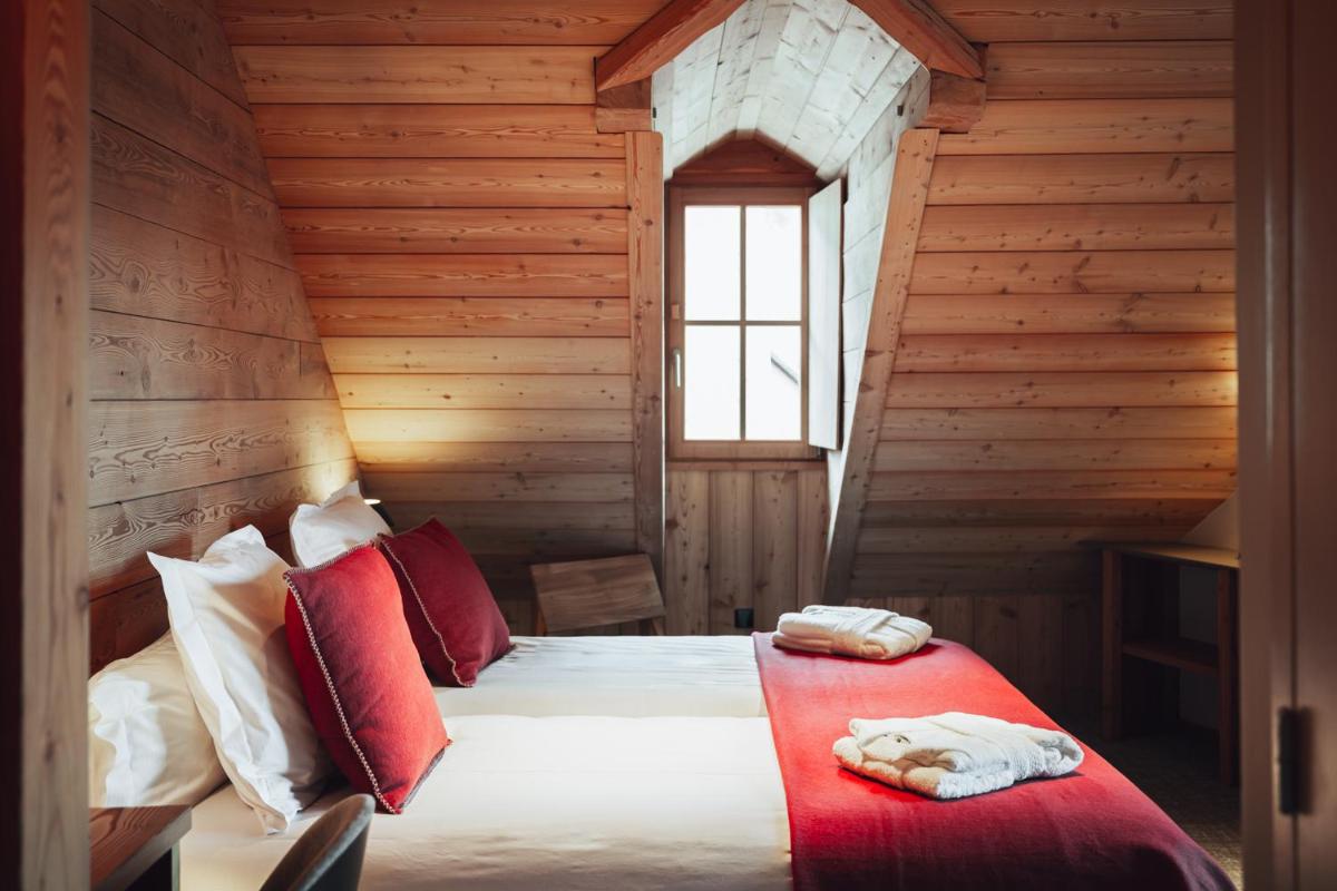 Un ou plusieurs lits dans un hébergement de l'établissement Alliey & Spa Piscine Appart-hôtel Serre chevalier