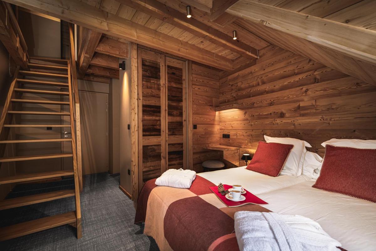 Un ou plusieurs lits dans un hébergement de l'établissement Alliey & Spa Piscine Appart-hôtel Serre chevalier