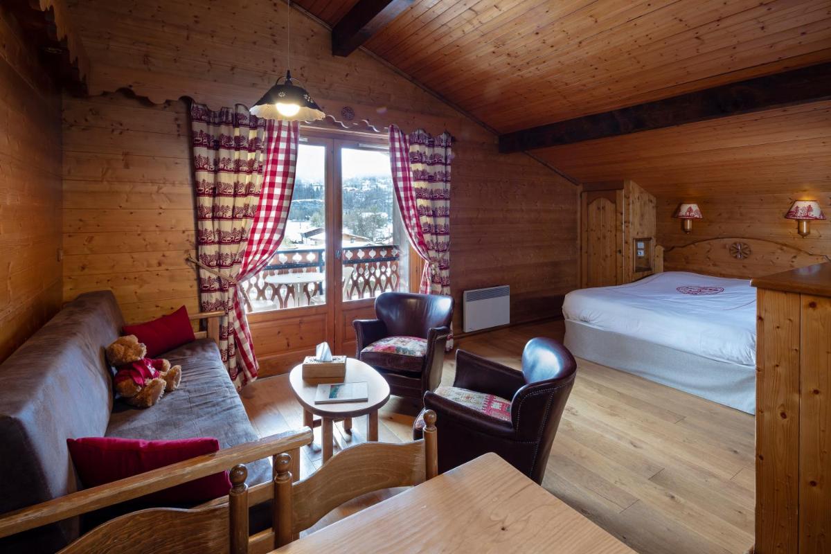 Un ou plusieurs lits dans un hébergement de l'établissement Chalet-Hôtel Neige et Roc, The Originals Relais