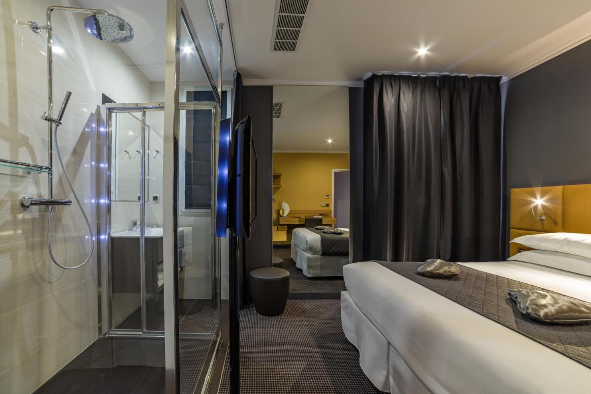 Un ou plusieurs lits dans un hébergement de l'établissement Hotel Residence Europe & Spa