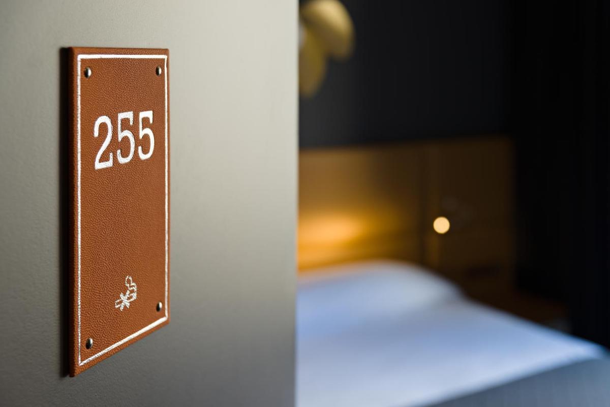 Un ou plusieurs lits dans un hébergement de l'établissement Hotel Residence Europe & Spa
