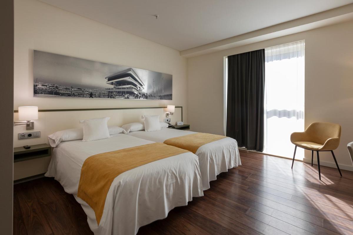 Cama o camas de una habitación en Primus Valencia