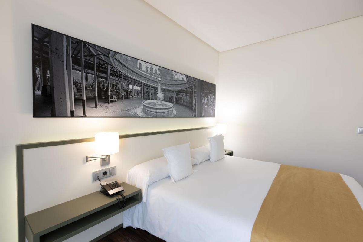 Cama o camas de una habitación en Primus Valencia