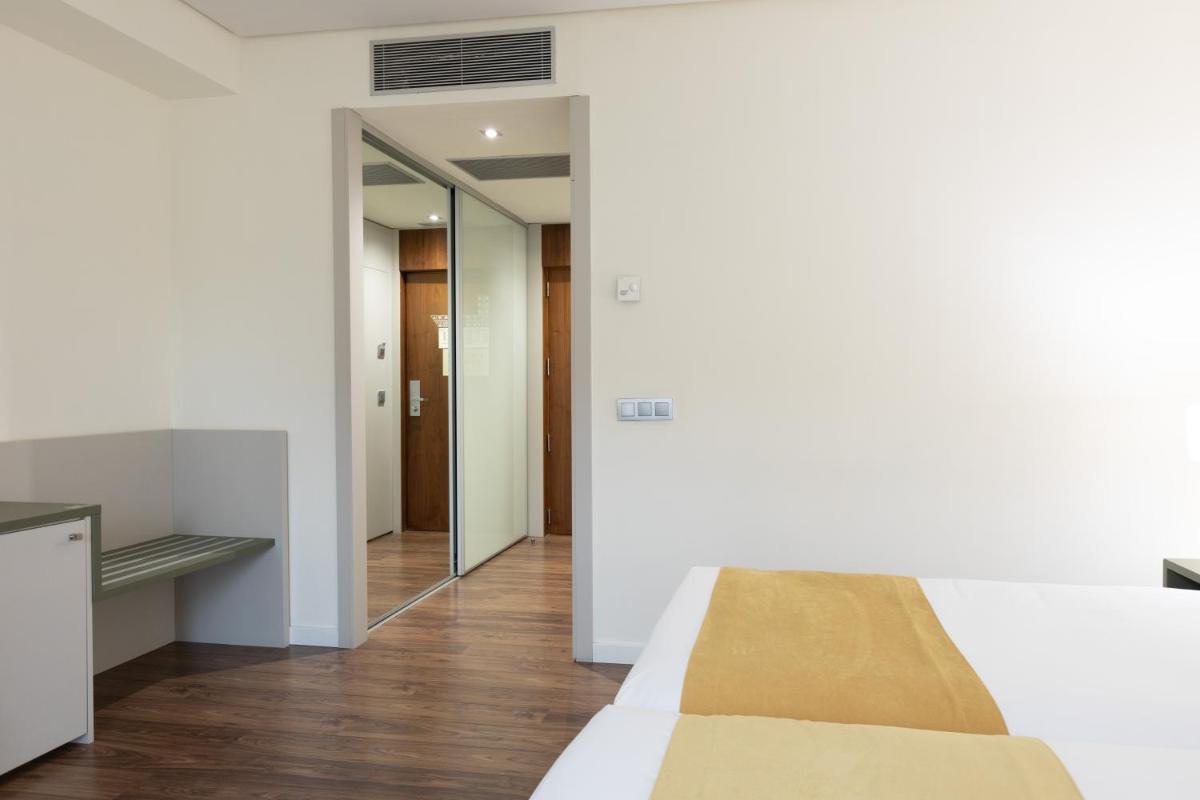 Cama o camas de una habitación en Primus Valencia