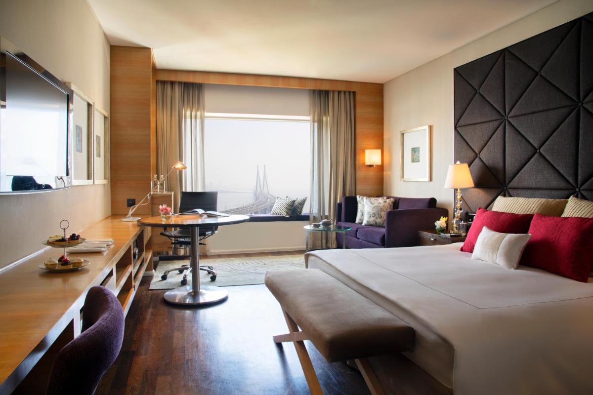 a hotel room with a bed and a desk at Taj Lands End in Mumbai a hotel room with a bed and a desk at Taj Lands End in Mumbai