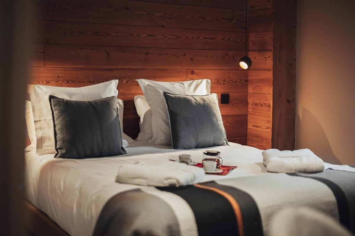 Un ou plusieurs lits dans un hébergement de l'établissement Alliey & Spa Piscine Appart-hôtel Serre chevalier