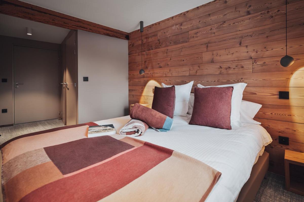 Un ou plusieurs lits dans un hébergement de l'établissement Alliey & Spa Piscine Appart-hôtel Serre chevalier