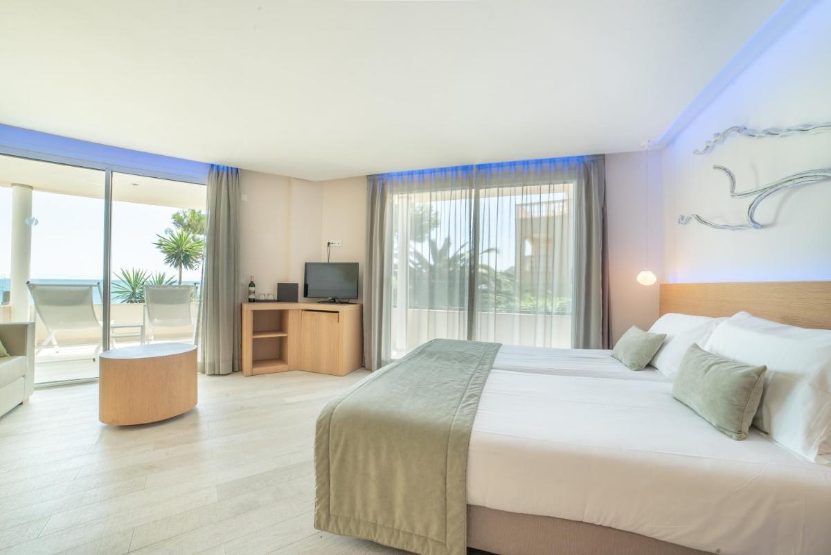 Cama o camas de una habitación en Melbeach Hotel & Spa - Adults Only