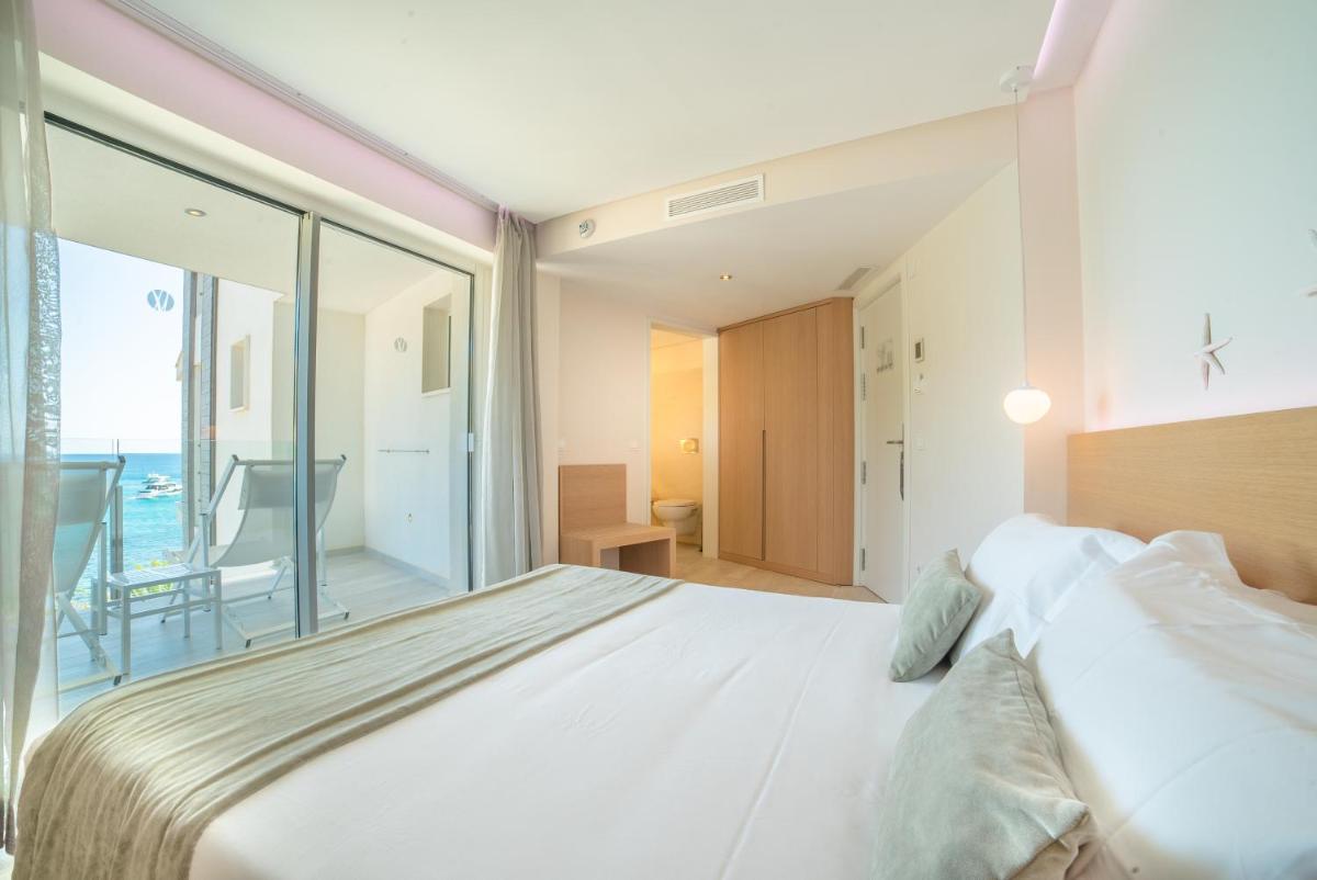 Cama o camas de una habitación en Melbeach Hotel & Spa - Adults Only