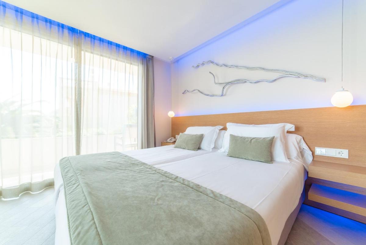Cama o camas de una habitación en Melbeach Hotel & Spa - Adults Only