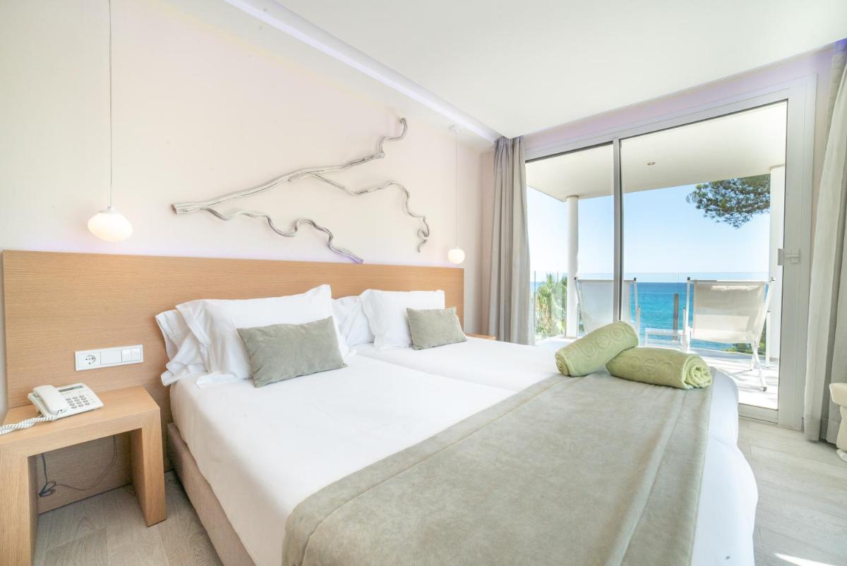 Cama o camas de una habitación en Melbeach Hotel & Spa - Adults Only