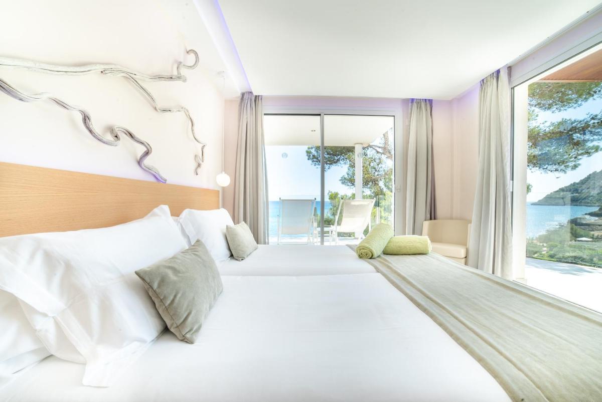 Cama o camas de una habitación en Melbeach Hotel & Spa - Adults Only