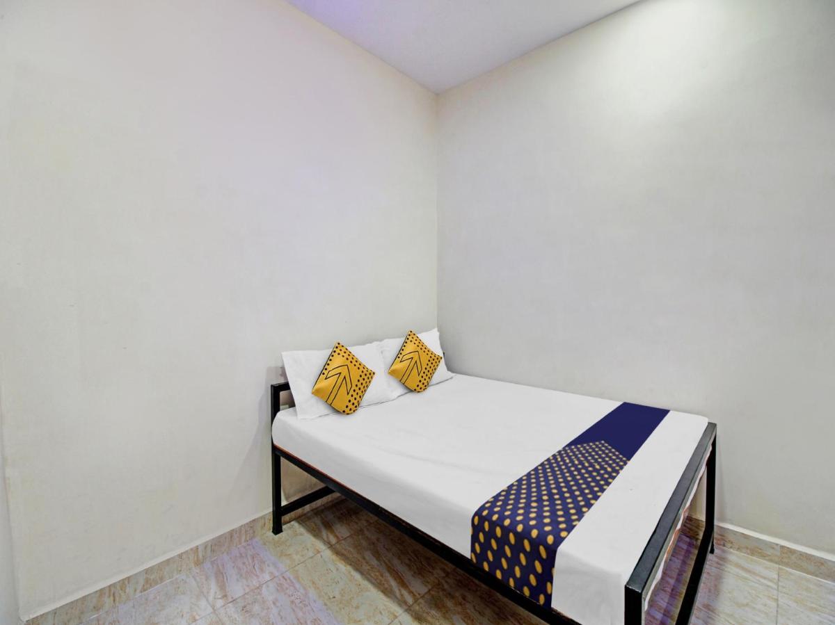 SPOT ON 81128 Hotel Happy Stay Lodge - Housity