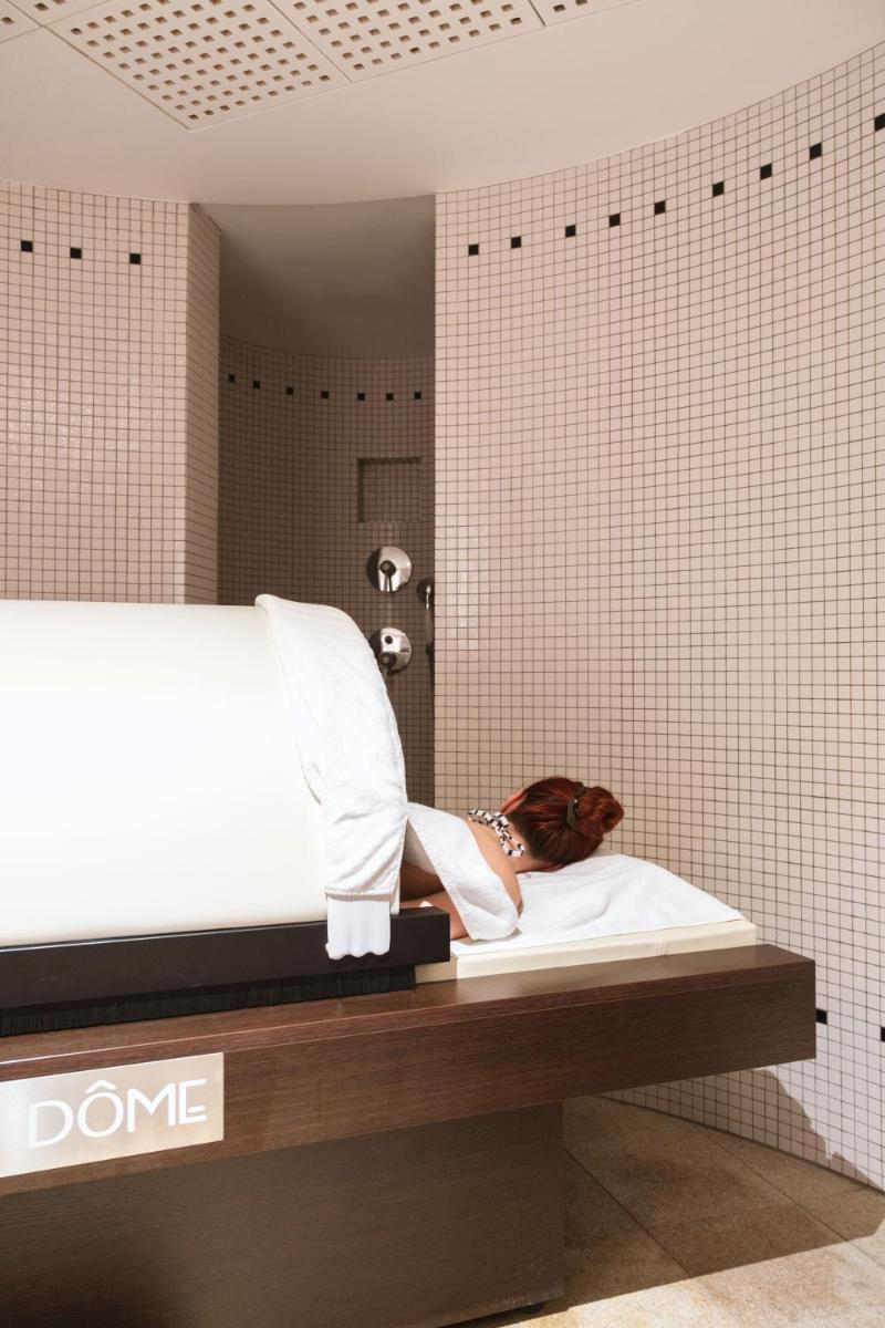 Un ou plusieurs lits dans un hébergement de l'établissement L'Agapa Hôtel - Spa Codage