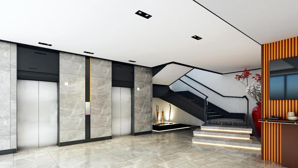 a hallway with a staircase in a house at Hyatt Centric Hebbal Bengaluru in Bengaluru