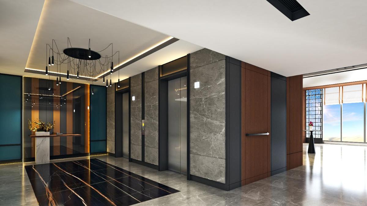 a hallway with blue walls and a ceiling with a chandelier at Hyatt Centric Hebbal Bengaluru in Bengaluru