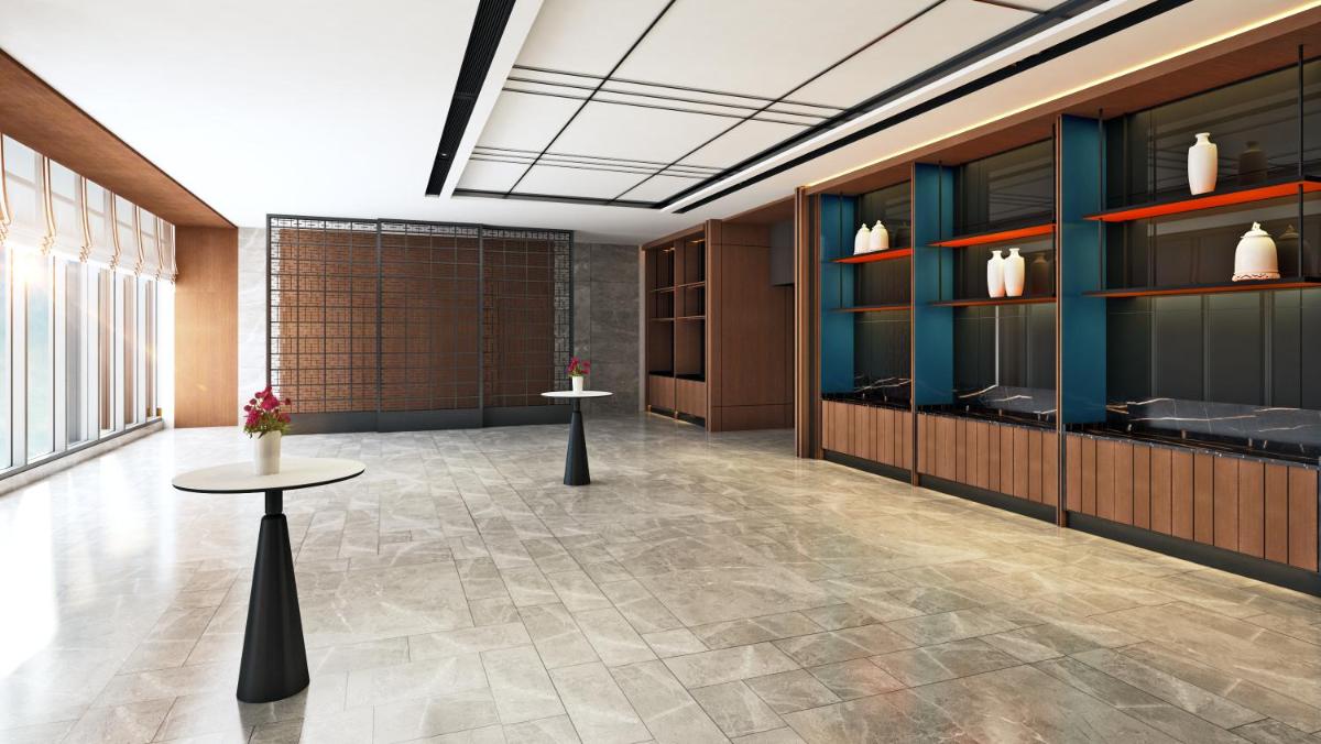 a lobby with two tables in a room at Hyatt Centric Hebbal Bengaluru in Bengaluru